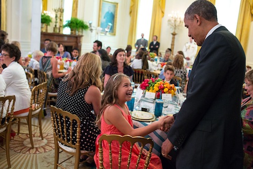 President Barack Obama greets guests at the Kids' State Dinner in the East Room of the White House, July 9, 2013. (Official White House photo by Pete Souza)